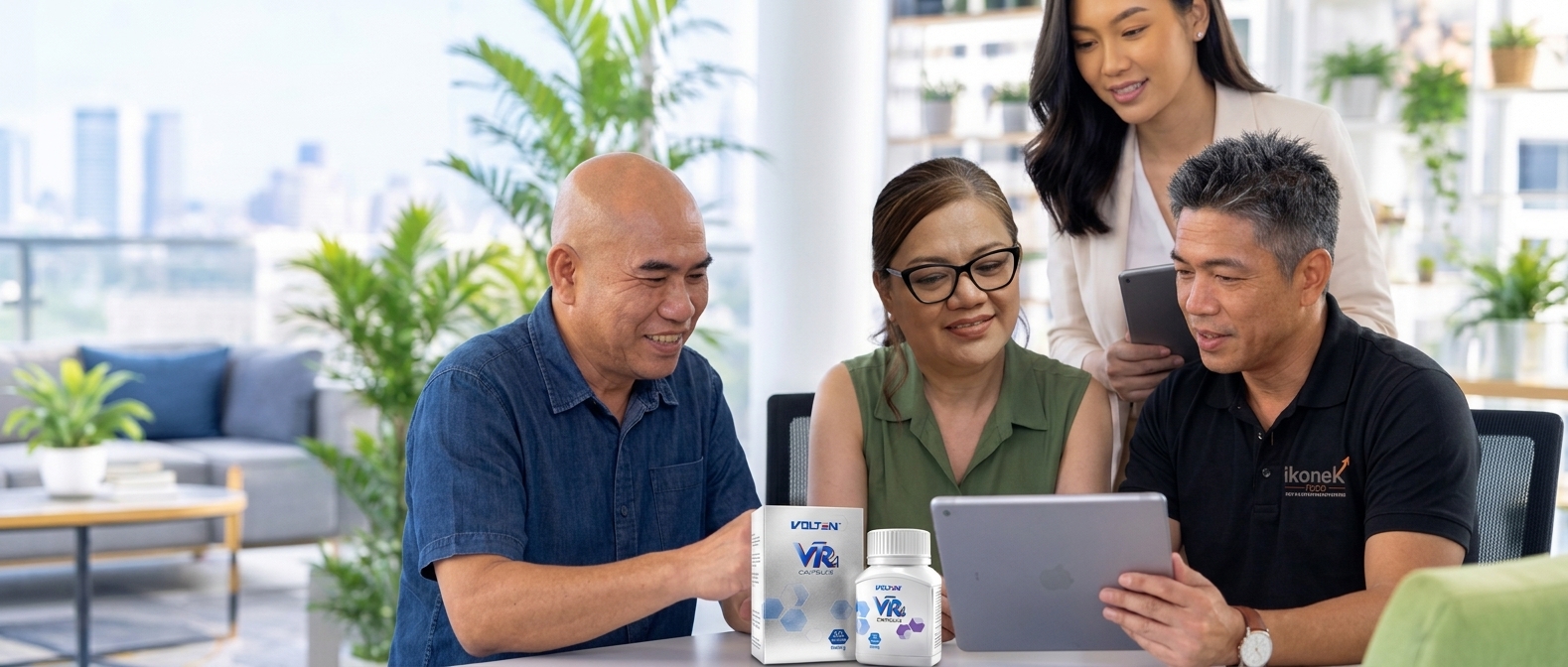 iKonek team leaders collaborating around products and a tablet